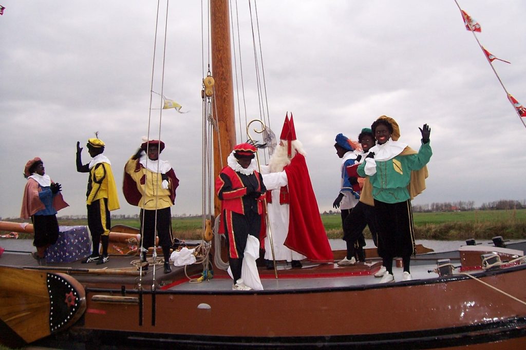 Arrival of Sinterklaas and Black Peet on a boat - Sinterklaas festival in the Netherlands